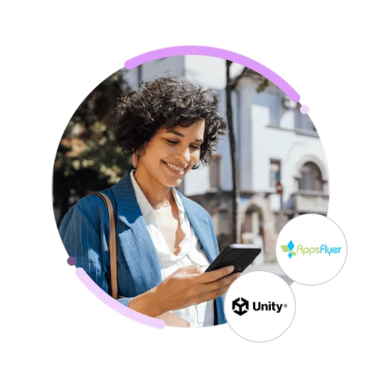 A photo of a woman using her phone, with the Appsflyer and Unity logos.